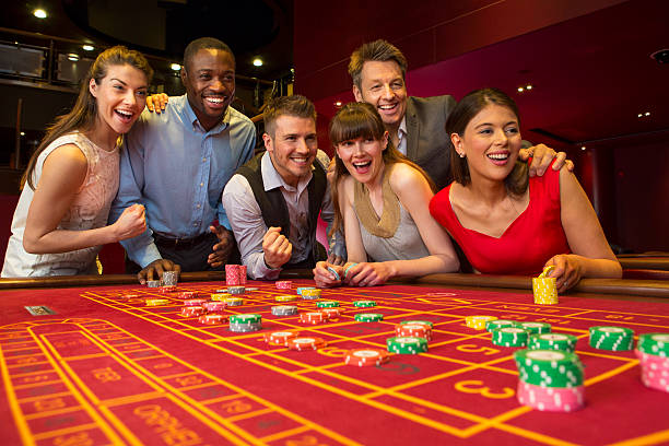 Dealer spinning the wheel with studio lighting