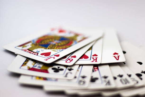 Dealer dealing cards at a live baccarat table
